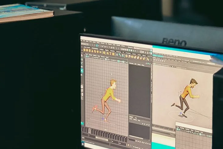 Poste de travail d'animation 3D avec un personnage en cours de modélisation à l'écran, le type de scène soumise au réseau Render pour être rendue